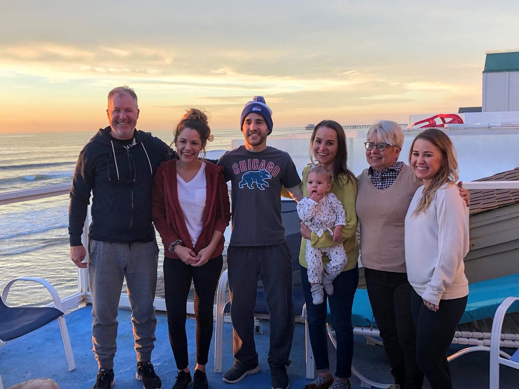 andrew’s father steve flack, andrew’s sister megan flack, andrew, andrew’s sister kelly kee (holding her daughter leila), andrew’s mother suzy flack and andrew’s sister katy comoglio