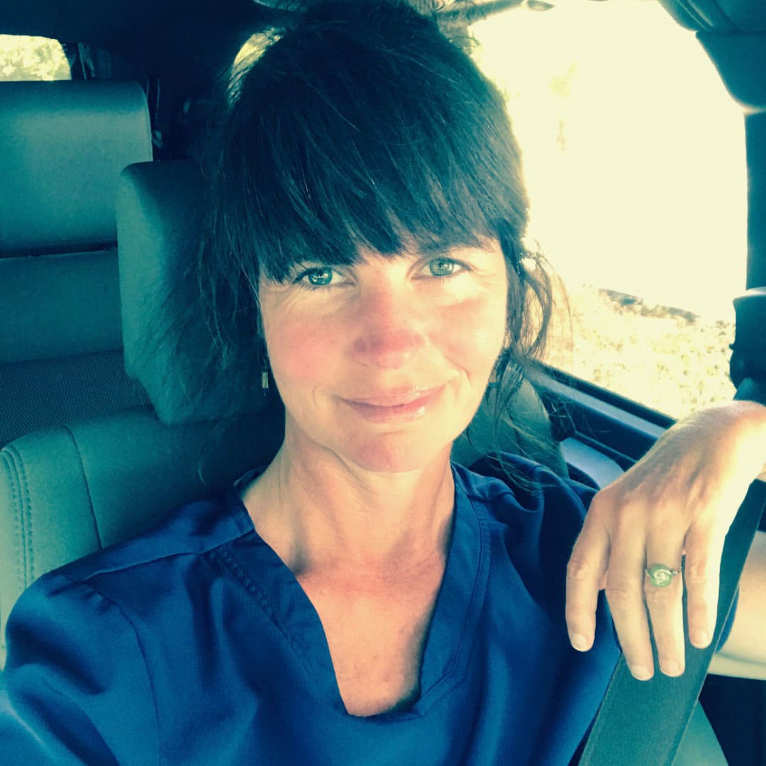 Tara Lee sits in her car