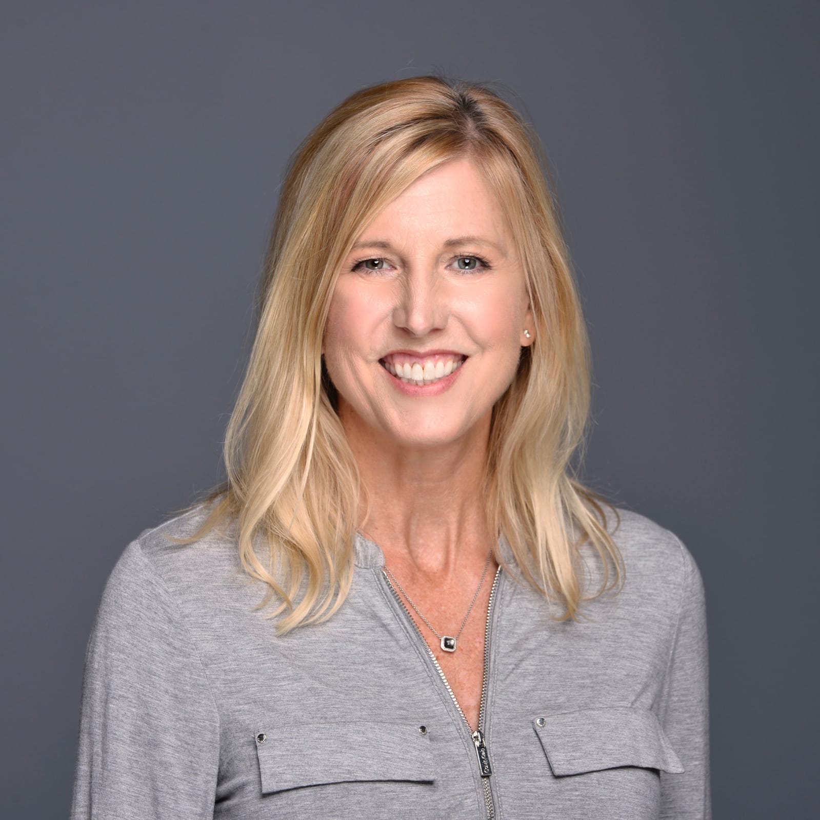 Barbara Little Headshot on Gray Background
