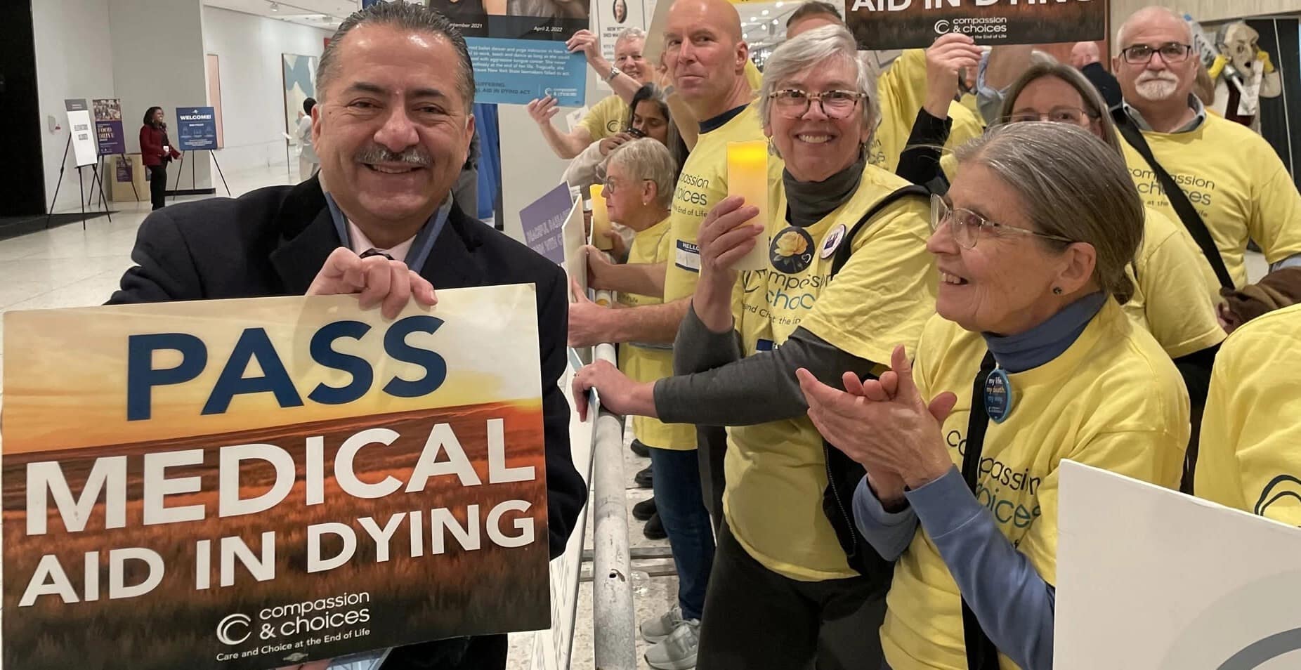 New York Volunteers holding a sign saying