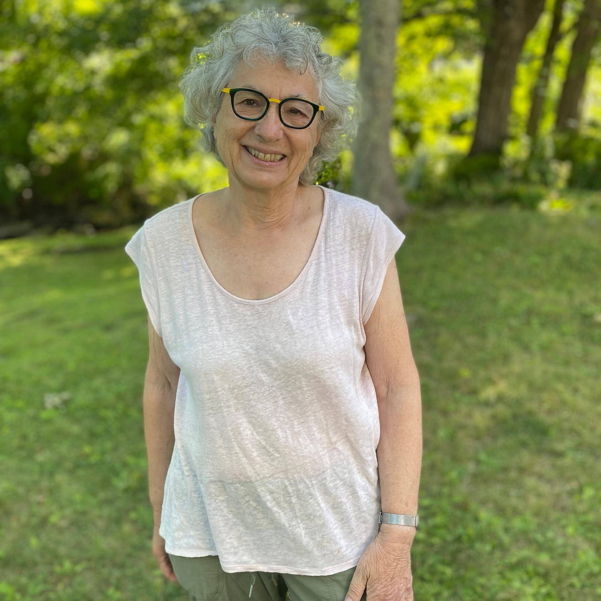Lise Dondy standing outdoors in front of trees