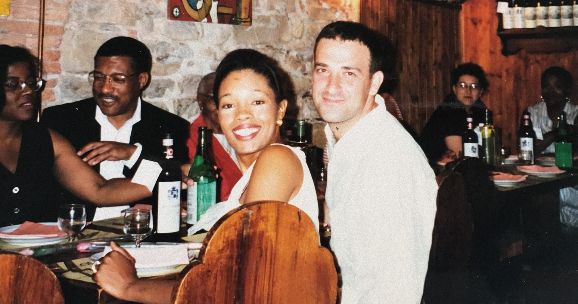 Tembi seated at a table with Saro.