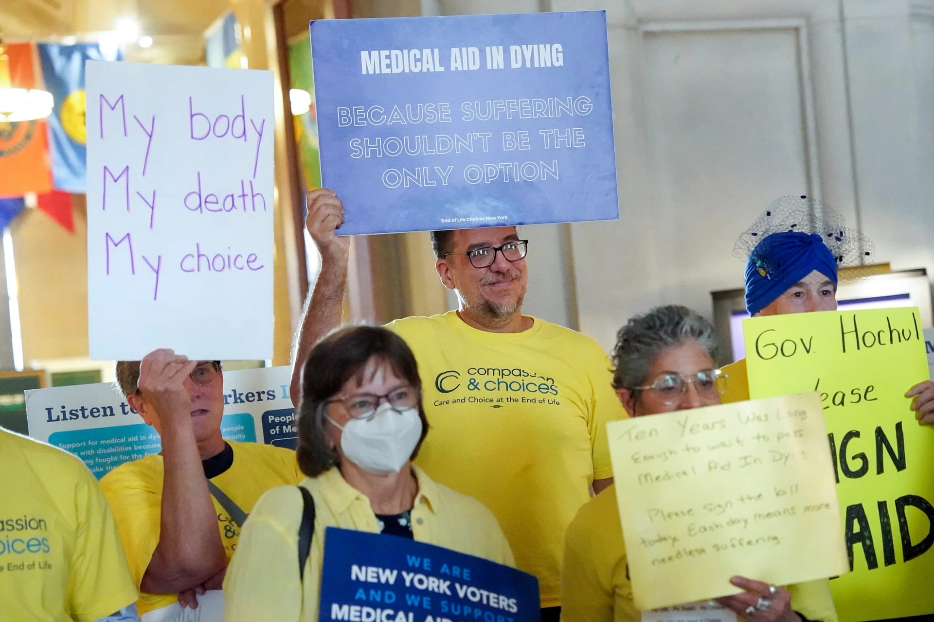 cc supporters at ny rally with signs
