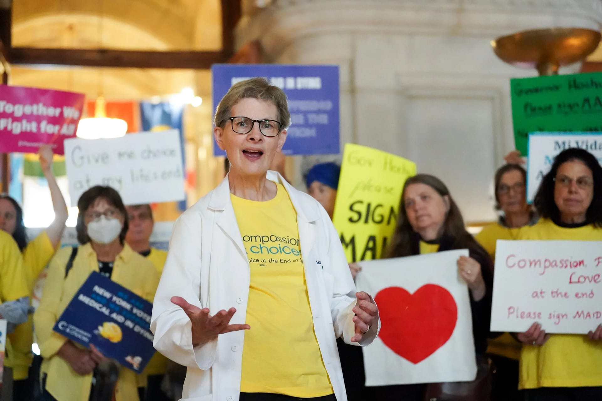 Supporters at a Rally in New York holding signs