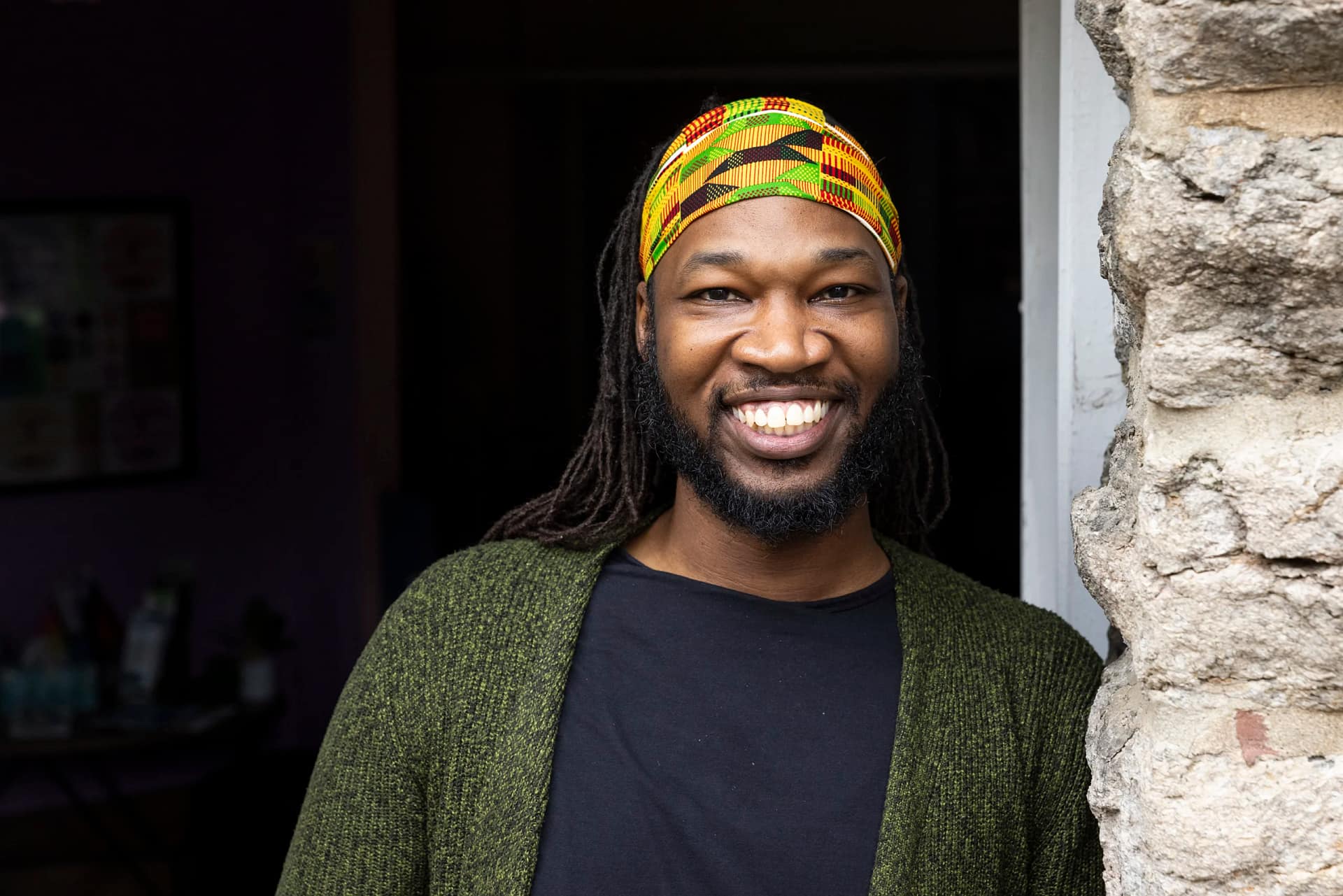 David Copeland smiling and leaning against a doorway