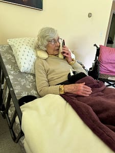 nana dunn in hospital bed on phone