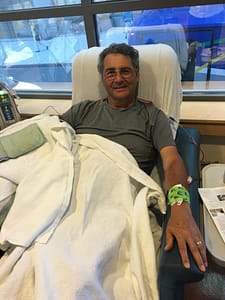 Dr. Kligler lays in a hospital bed