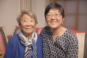 Fay Hoh Yin seated with her daughter
