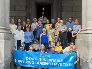 NY Supporters holding a blue banner