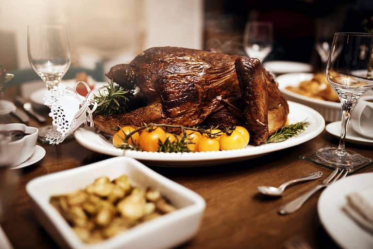 A Turkey Dinner surrounded by side dishes.