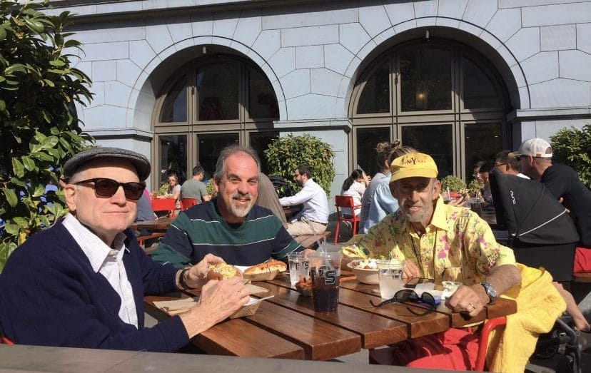 Ed Casson, Ken May and Stephen May at a dining table