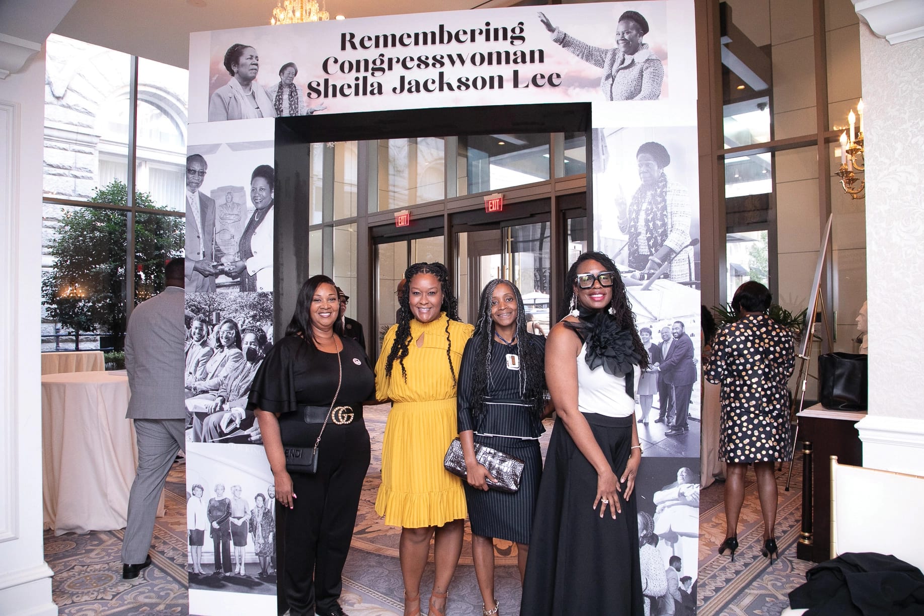 Four members of Compassion & Choices African American Leadership Council members standing underneath an archway dedicated to congresswoman Sheila Jackson Lee